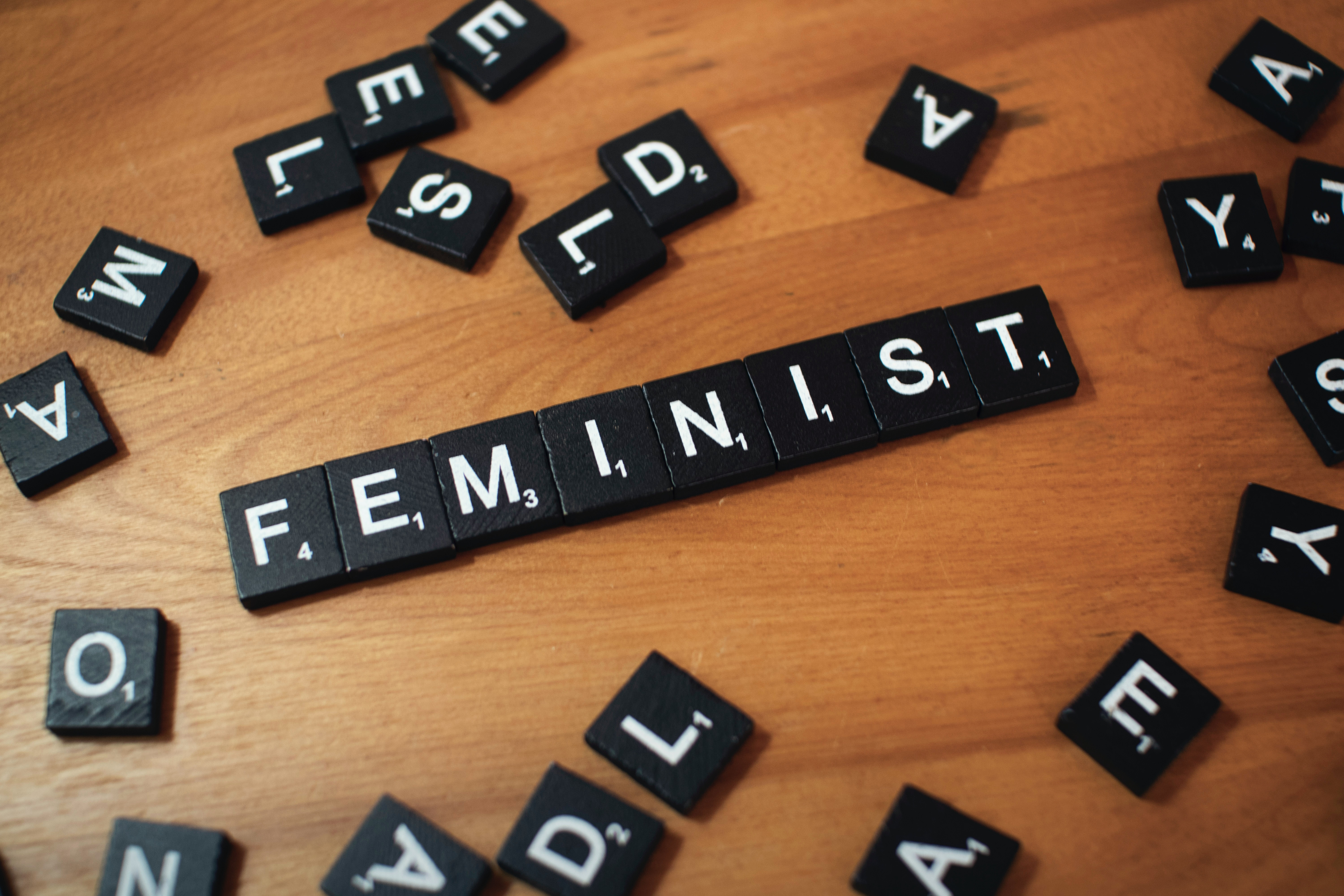 Photograph of scrabble tiles spelling 'feminist'